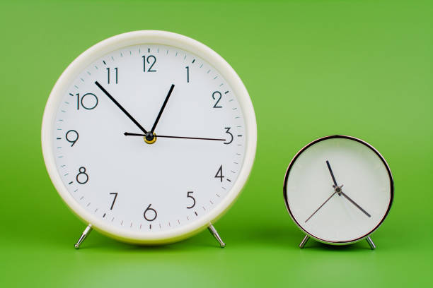istock Time and work with time photo alarm clock in studio quality time management concept 2203979837