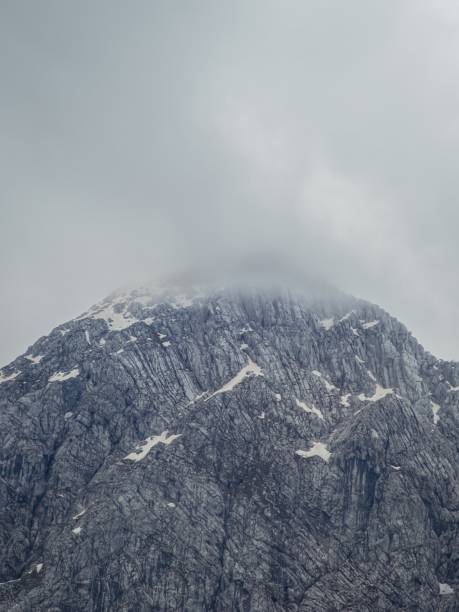 istock Misty mountain peak with rugged rock formations 2203983764