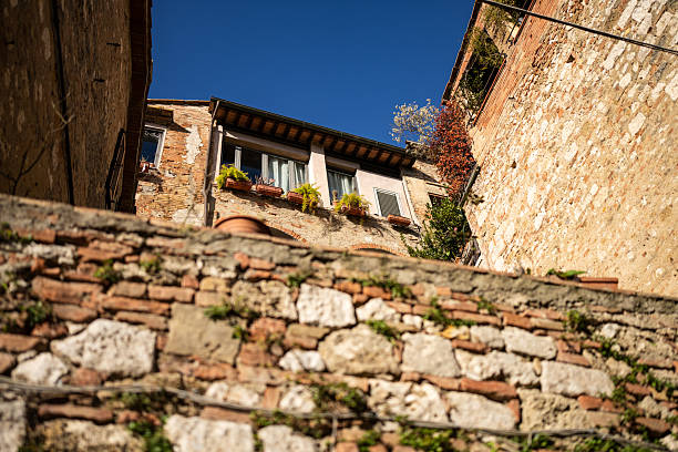 Typical Tuscany villages view: Colle Val D' Elsa borgo during a winter day. Narrow alleys in the medieval town