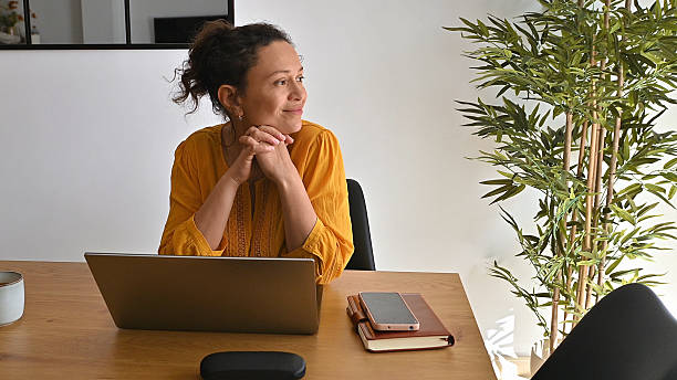 Entrepreneurial Woman Enjoying Remote Work in a Comfortable Home Office Environment