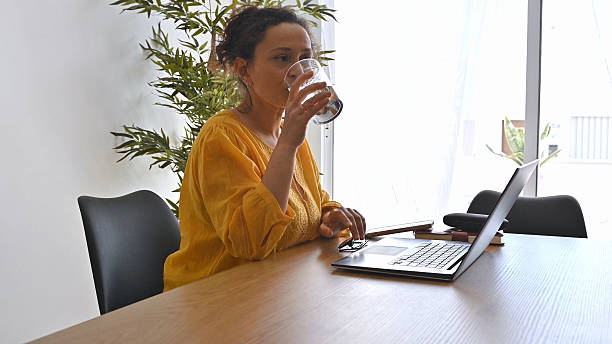 istock Woman Working Remotely From Home Office Enjoying a Balanced Lifestyle 2203987207