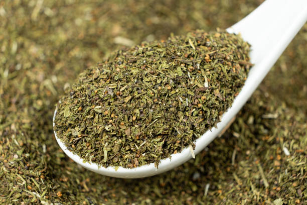 istock Savory herb seasoning in a spoon macro 2203987295