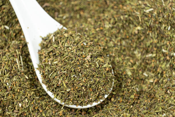 istock Savory herb seasoning in a spoon macro 2203987296