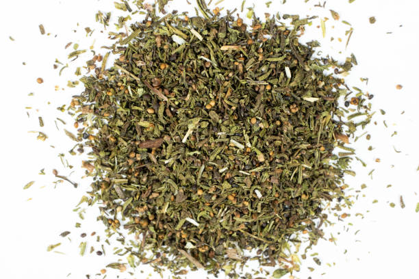 istock Culinary savory dried herb seasoning on white background top view. 2203987305