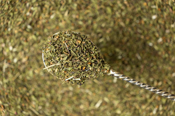 istock Savory herb seasoning in a spoon macro top view 2203987316