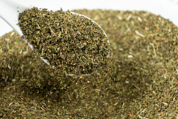 istock Savory herb seasoning in a spoon macro 2203987340