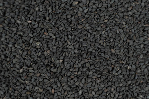 istock Whole black sesame seeds top view detailed shot 2203987367