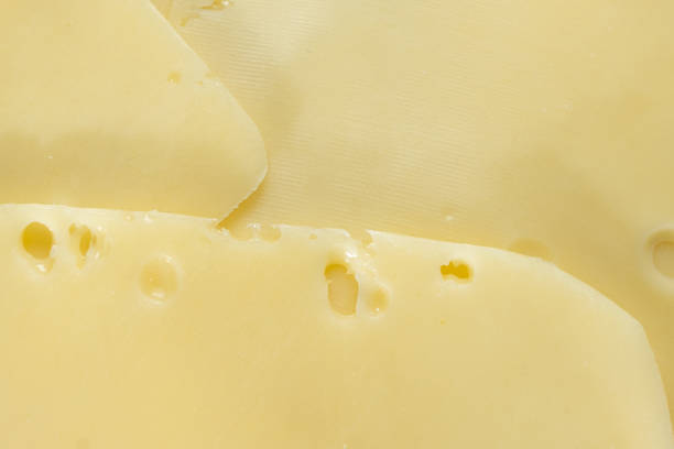 istock Delicate Semi-Hard Cheese Slices with Holes 2203987387