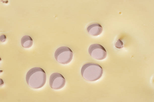 Smooth Yellow Cheese with Characteristic Holes.
