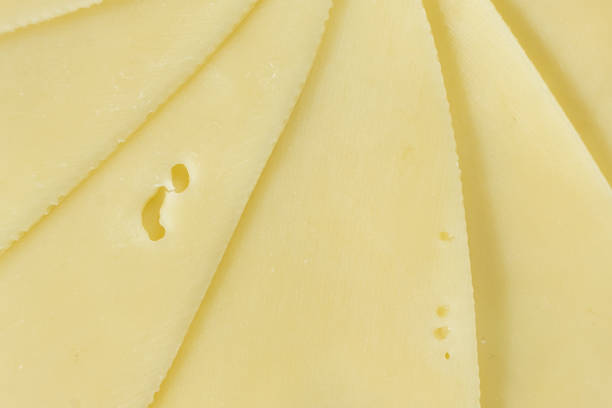 istock Semi-hard cheese close-up, thin slices, top view 2203987419
