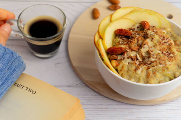 istock Apple oatmeal with coffee and book 2203991003