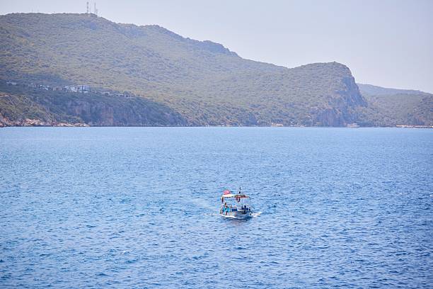 Kash, Turkey. - August 2, 2024: Turkish ship sails in the Mediterranean Sea
