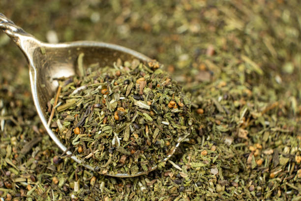 istock Savory herb seasoning in a spoon macro 2203993495