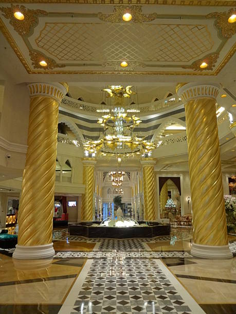 istock Yellow shiny flashy columns and marble floor. 2203995148