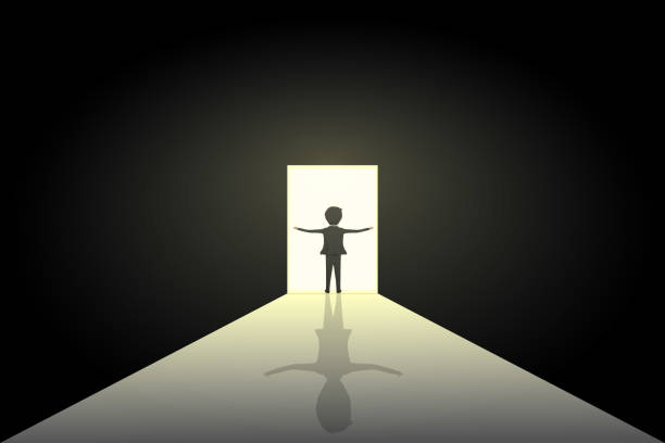 istock man at the door of light 2203997503