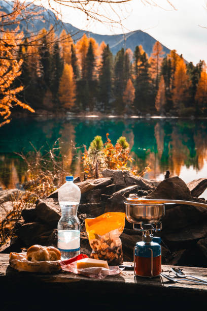 istock Campsite on mountain lake and forest in autumn 2203998157