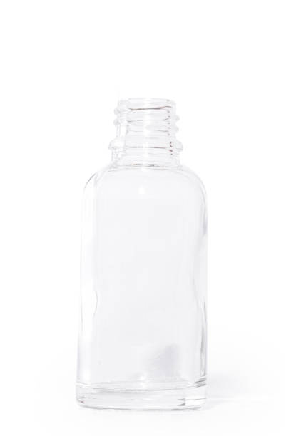 istock Empty Transparent Glass Bottle for Skincare and Essential Oils on White Background – Minimalist Packaging 2203998274