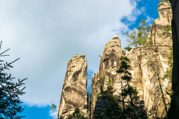 Majestic sandstone cliffs surrounded by lush greenery and forests for tourism, ecotourism, nature advertising, travel guides, tourism websites