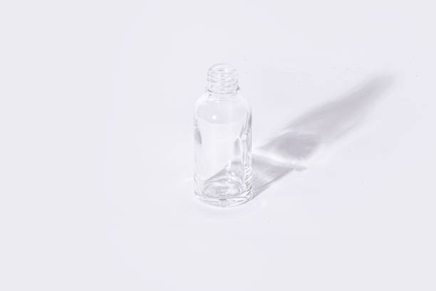 istock Empty Transparent Glass Bottle for Skincare and Essential Oils on White Background – Minimalist Packaging 2203999332