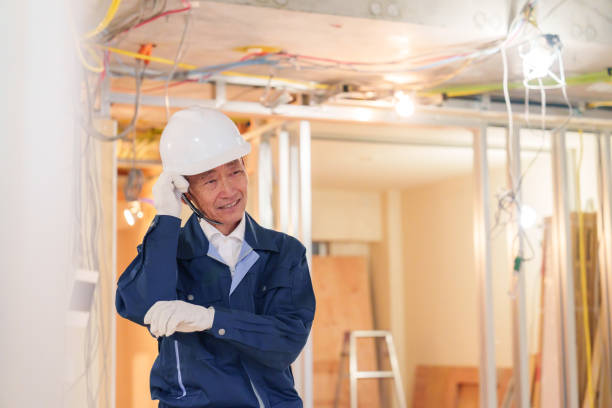 istock Male carpenter working on a condominium renovation site 2203999980