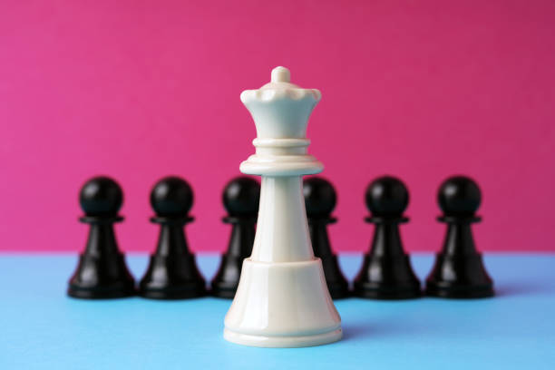 White queen chess in front of black pawn