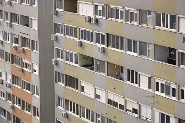 istock apartment building facade with windows and balconies 2204005746