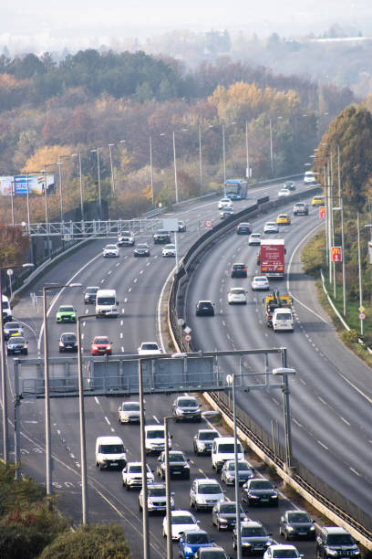 istock highway traffic with autumn trees in the background 2204005751