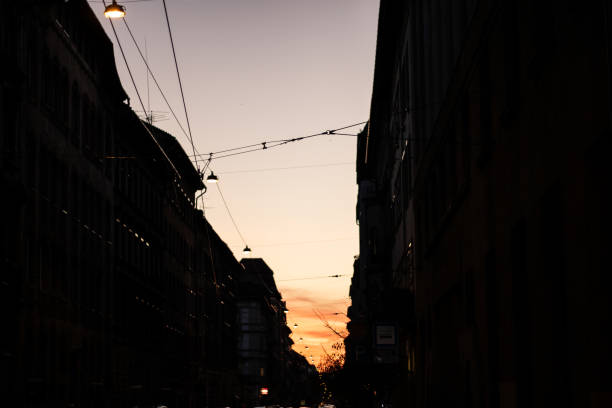 istock narrow city street at sunset 2204006216