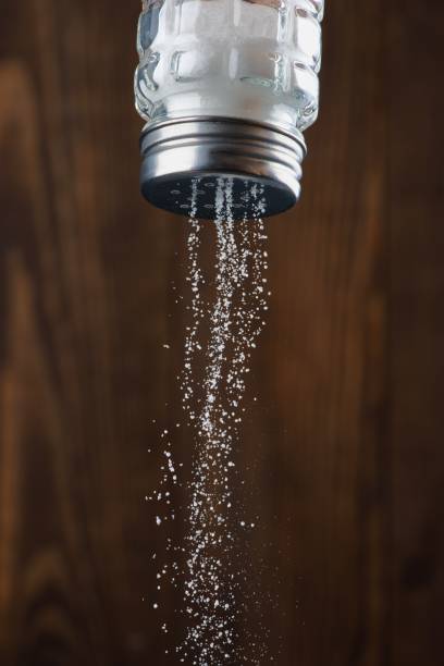istock Organic salt on wooden background 2204010875