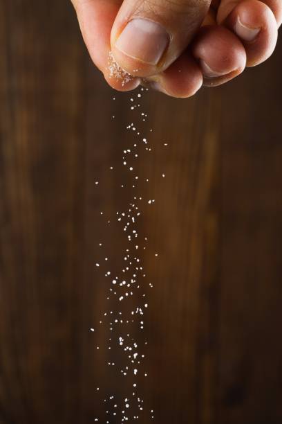 istock Organic salt on wooden background 2204010952