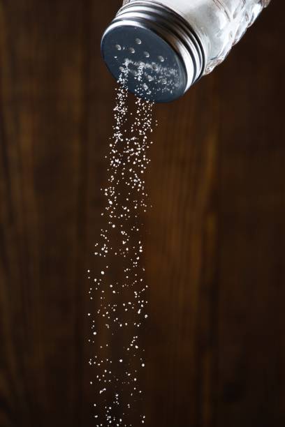 istock Organic salt on wooden background 2204010955