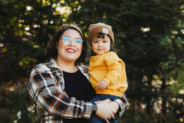 istock Little Girl and Mom Outside 2204011013