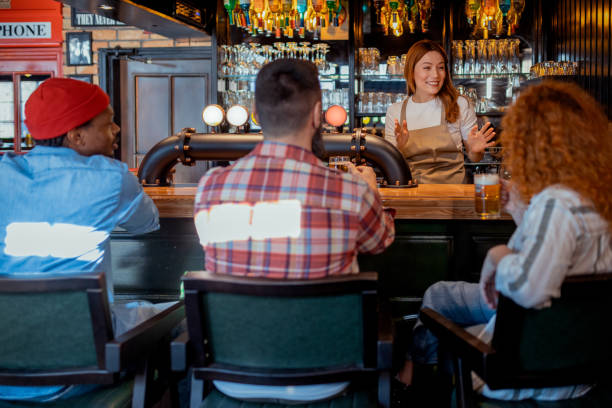 istock Lively Bar Scene with Friends and a Bartender 2204012765