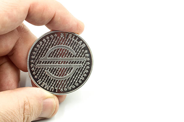 Hand holding a cryptocurrency of LUMEN STELLAR.