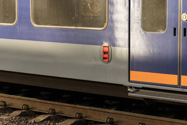 istock Train car stands on railway tracks showcasing its colorful exterior design and structural features under clear daylight conditions 2204016114
