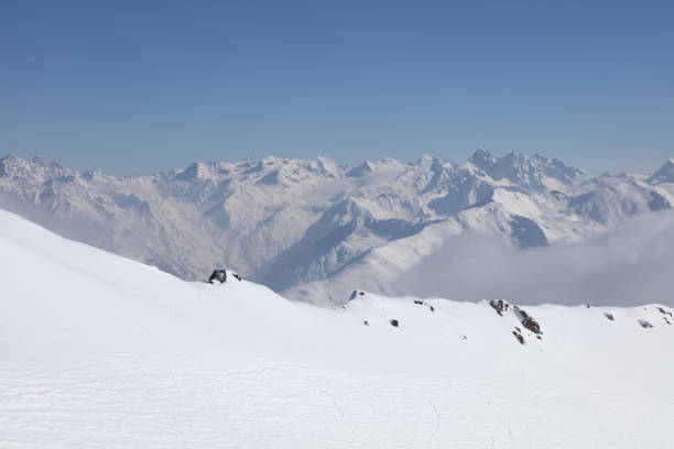 Alpine skiing. Powder snow. Perfect of piste ski slope.  High mountain  landscape  At the top. sunny ski resorts Val Gardena  Snowcapped mountain  Dolomite super ski area. Ski resort. italy, Europe. Clear blue  sky, for copy space.