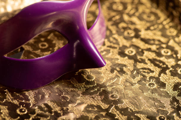 Carnival mask, beautiful carnival mask placed on an old metal surface with beautiful embossed ornaments, selective focus.