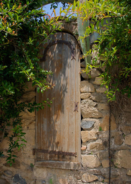 istock Stone Wall and Antique Wooden Door 2204023280