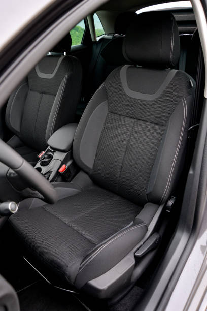 istock Modern car interior with black fabric seats 2204025370