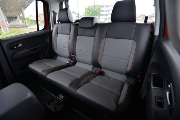istock Comfortable back seats in a pickup truck Grey leather upholstery with orange stitching 2204025571