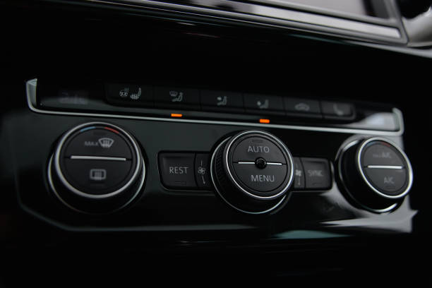 istock Modern car climate control panel with buttons and dials for temperature fan speed and AC 2204025781