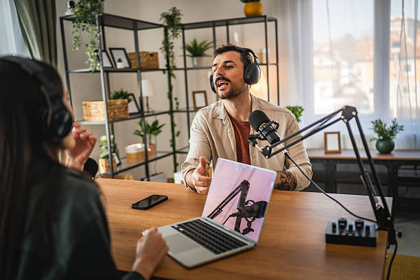 istock man host interviewer woman guest record podcast at home studio 2204025906