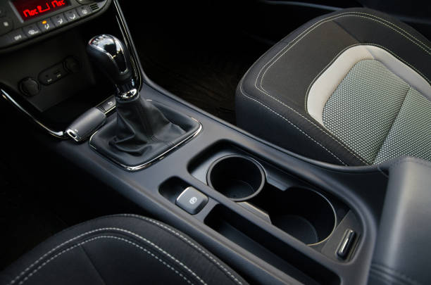 Modern car interior detail: gear shift console and cupholders
