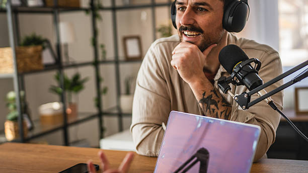 istock man host interviewer woman guest record podcast at home studio 2204026859