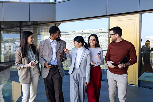 istock Business team walking in the office 2204034070