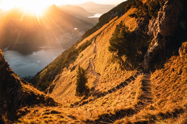 istock Elevated view of mountain pathway above lake in autumn 2204035687
