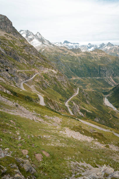 istock Elevated view of curving mountain road above valley 2204038368
