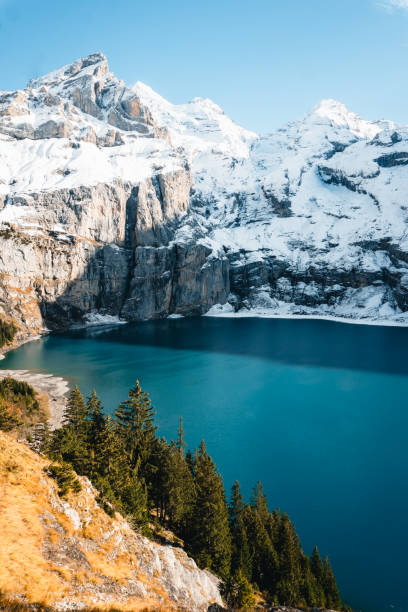 istock Snowcapped mountain reflected in lake, fresh snow 2204039180