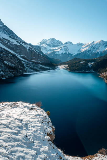 istock Snowcapped mountains, lake and fresh snow 2204039268