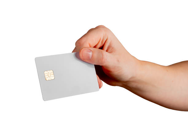 istock Female hand holding a blank credit card, tilted to showcase electronic payment, debit services, and 2204041347